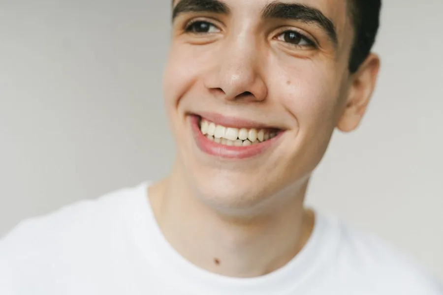 Young man with a confident smile after dental bonding in Fort Myers