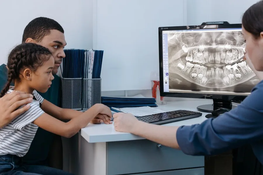 Dentist and patient reviewing a dental implant plan together in Fort Myers