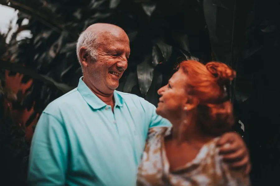 Happy senior couple deciding together between implants and dentures in Fort Myers